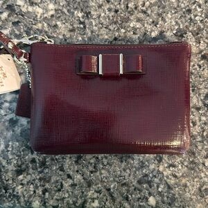 Coach Bow patent leather wristlet